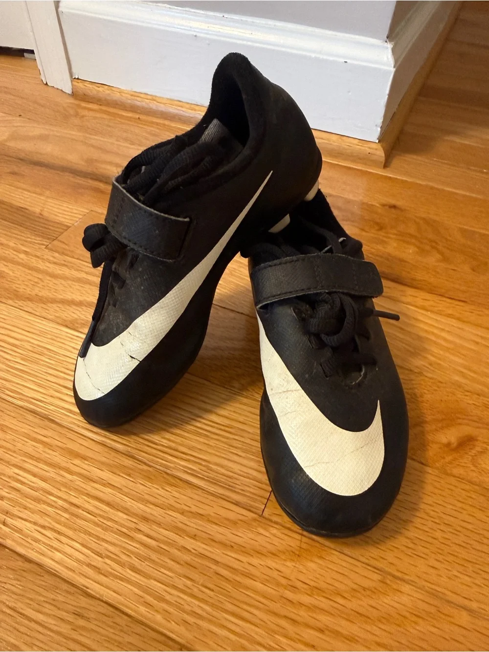 Nike Kids Black Soccer Cleats with White Swoosh